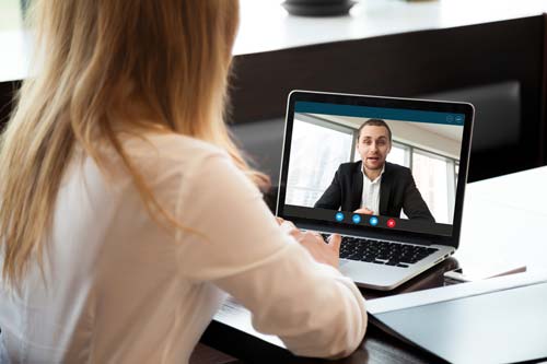 Virtual CFO Working With Client On Laptop Over Video Meeting