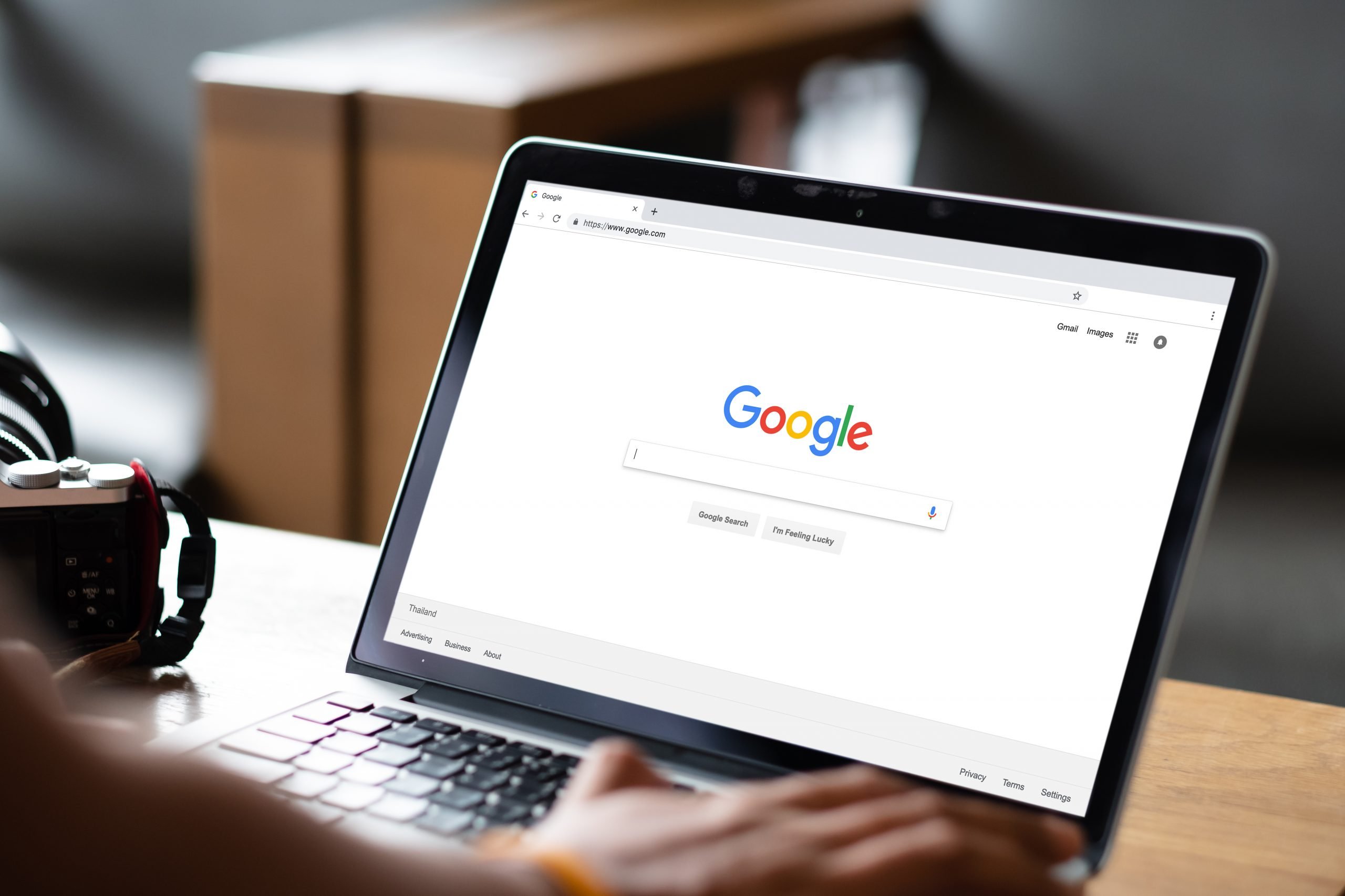 a man performing a google search on a laptop