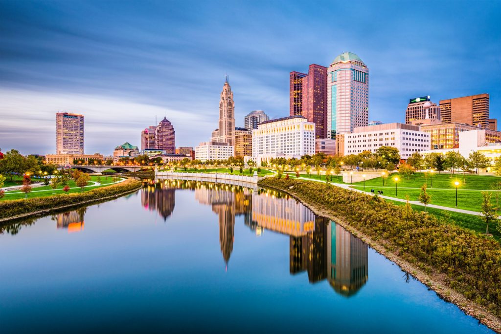 Columbus, Ohio, USA skyline on the river at dusk.